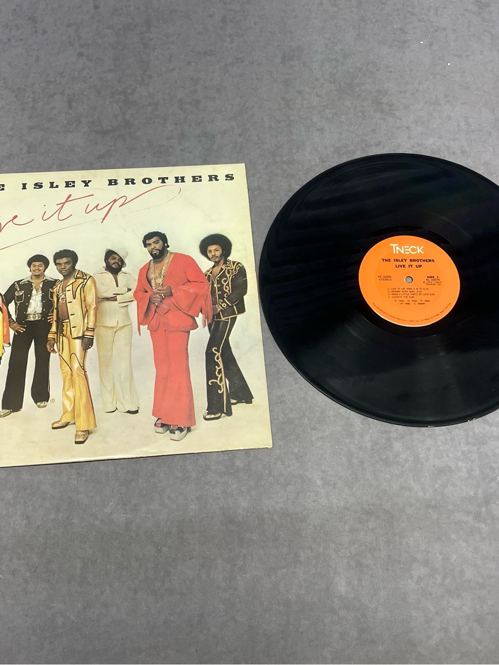 The Isley Brothers "Live It Up" Vinyl Record - Black LP with Orange Label